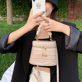 Crocodile-effect bucket bag with shoulder strap