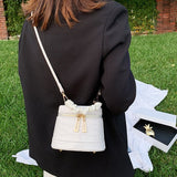Crocodile-effect bucket bag with shoulder strap