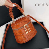 Crocodile-effect bucket bag with shoulder strap